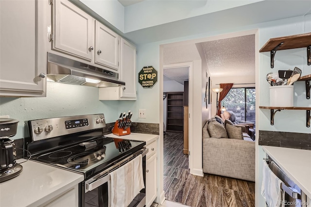 kitchen with under cabinet range hood, wood finish floors, white cabinets, electric stove, and light countertops