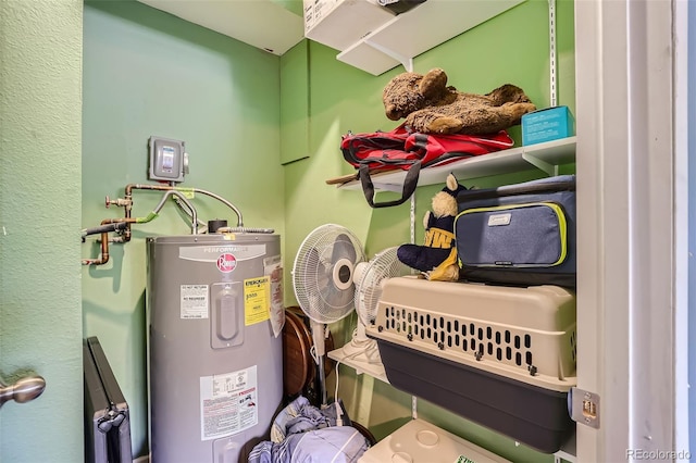 utility room featuring water heater