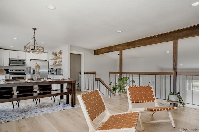 8559 W 75th Pl, Arvada, CO 80005 - dining area with beamed ceiling, light wood-style flooring, and recessed lighting