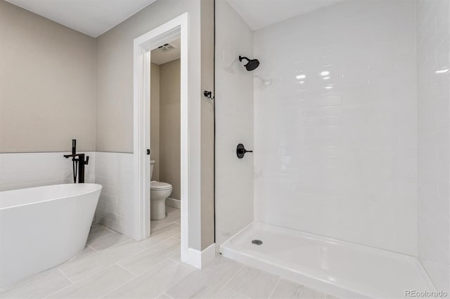 46 Douglas Dr, Broomfield, CO 80020 - full bathroom featuring a soaking tub and a shower stall