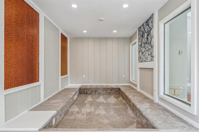 46 Douglas Dr, Broomfield, CO 80020 - spare room featuring carpet floors, a smoke detector, a decorative wall, and recessed lighting