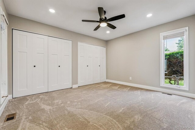 46 Douglas Dr, Broomfield, CO 80020 - unfurnished bedroom featuring two closets, carpet flooring, recessed lighting, and ceiling fan