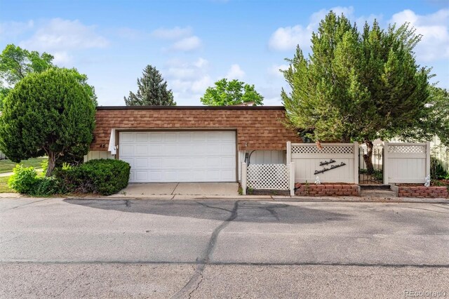 46 Douglas Dr, Broomfield, CO 80020 - view of front of property featuring a garage and mansard roof