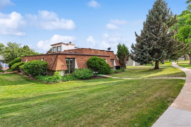 46 Douglas Dr, Broomfield, CO 80020 - view of home's exterior featuring a yard and mansard roof