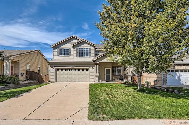 view of front of house with a garage and a front yard