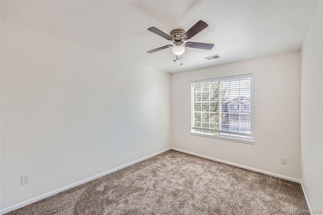 unfurnished room with ceiling fan and carpet floors