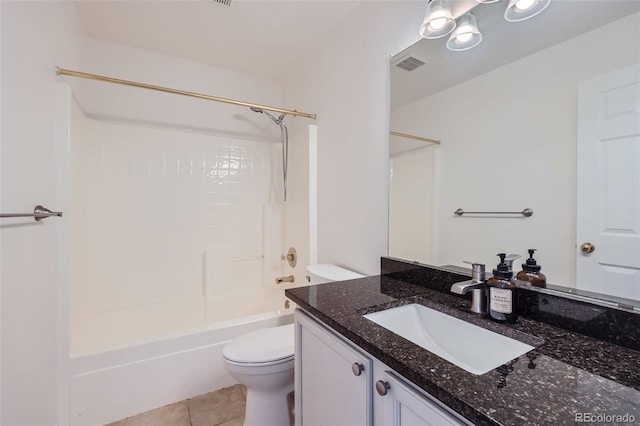 full bathroom with tile patterned floors, bathtub / shower combination, toilet, and vanity