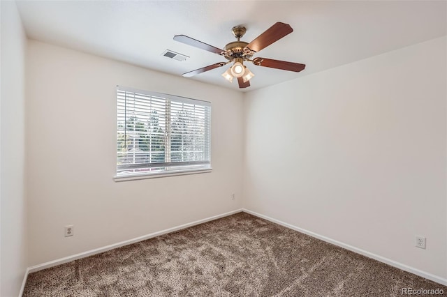 carpeted empty room featuring ceiling fan