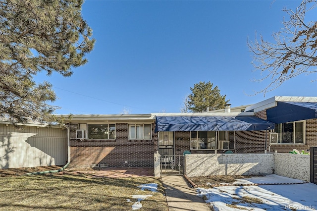 rear view of property with a lawn