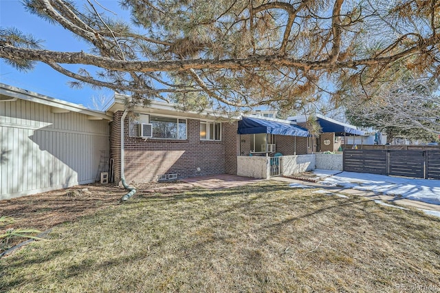 exterior space with a patio area and a lawn