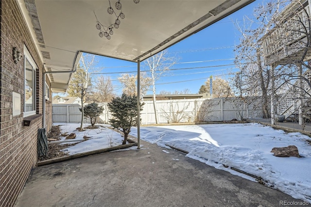 view of snow covered patio