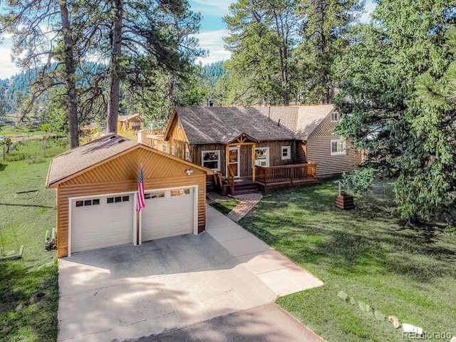 view of front of property with a garage and a front yard