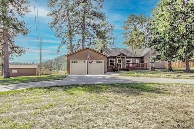 ranch-style home featuring a front yard and a garage