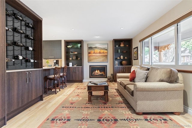 1615 Violet St, Golden, CO 80401 - living room with light wood-style flooring, a lit fireplace, and recessed lighting