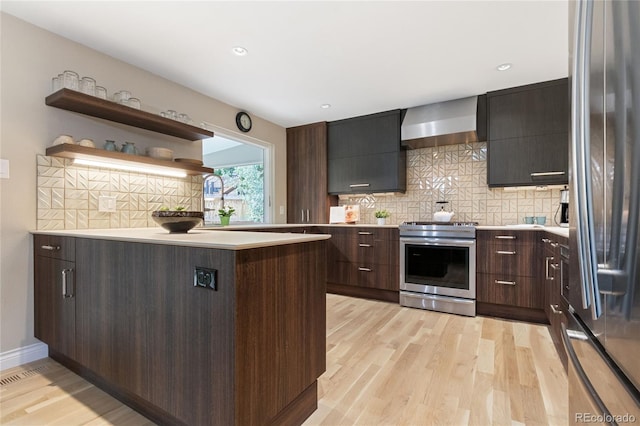 1615 Violet St, Golden, CO 80401 - kitchen featuring wall chimney exhaust hood, stainless steel appliances, light countertops, modern cabinets, and recessed lighting