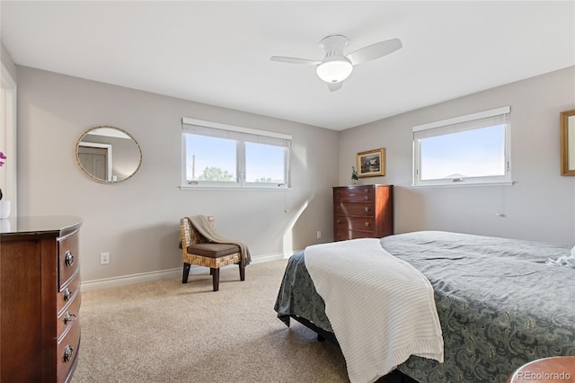1615 Violet St, Golden, CO 80401 - bedroom with multiple windows, light carpet, and ceiling fan