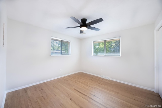 empty room with light hardwood / wood-style floors and ceiling fan