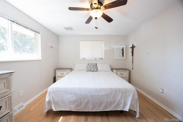 bedroom featuring ceiling fan and light hardwood / wood-style flooring