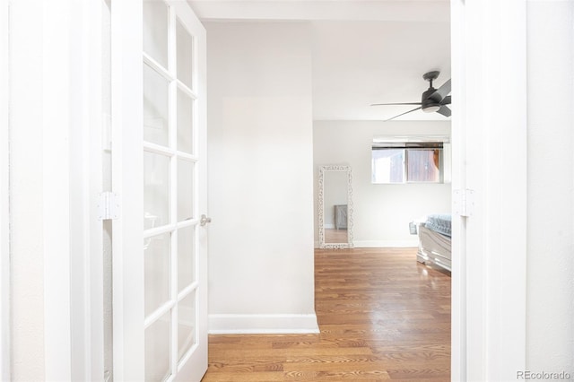 hall with hardwood / wood-style flooring