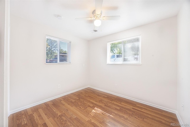 unfurnished room with wood-type flooring and ceiling fan