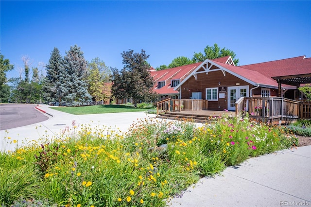 10966 W Half Moon Pass, Littleton, CO 80127 - view of front of house featuring a deck and a pergola