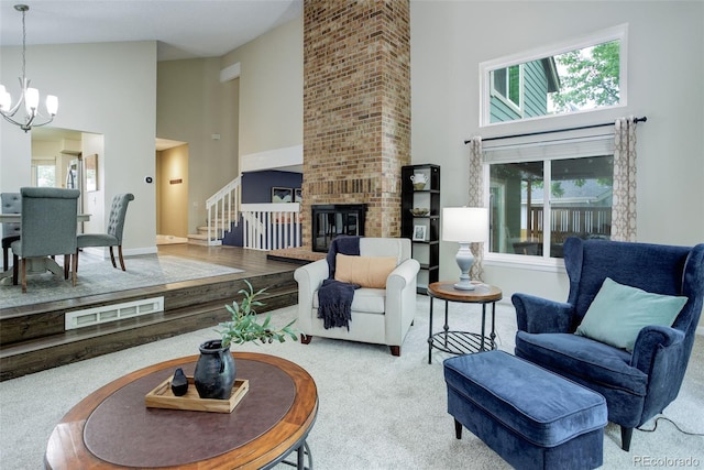10966 W Half Moon Pass, Littleton, CO 80127 - living area featuring high vaulted ceiling, a chandelier, carpet flooring, a fireplace, and stairs