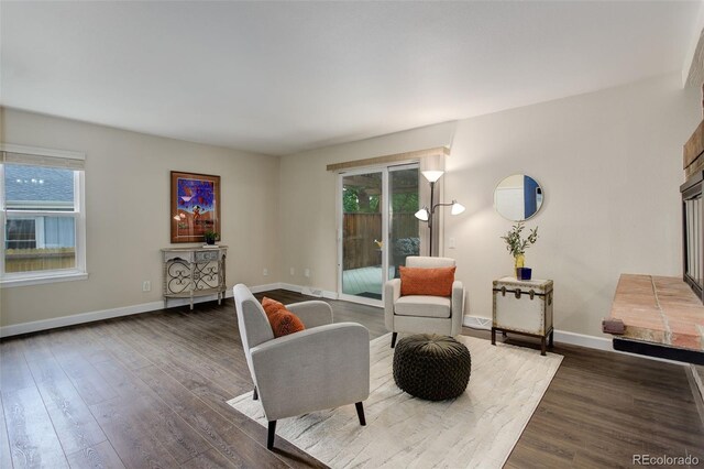 10966 W Half Moon Pass, Littleton, CO 80127 - living room featuring wood finished floors, healthy amount of natural light, and baseboards