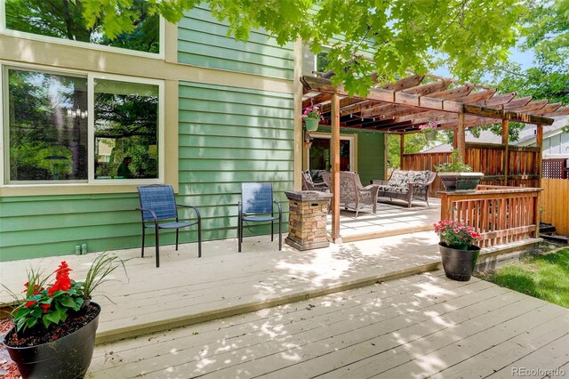 10966 W Half Moon Pass, Littleton, CO 80127 - deck with outdoor lounge area and a pergola