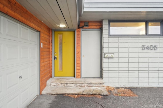 5405 S Lowell Blvd, Littleton, CO 80123 - doorway to property with a garage