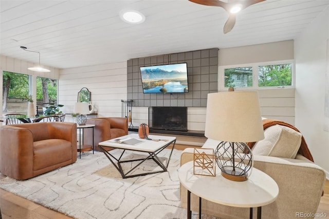 5405 S Lowell Blvd, Littleton, CO 80123 - living area with wood finished floors, a ceiling fan, and a fireplace