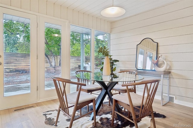 5405 S Lowell Blvd, Littleton, CO 80123 - sunroom / solarium featuring wood-type flooring, french doors, wooden walls, and plenty of natural light