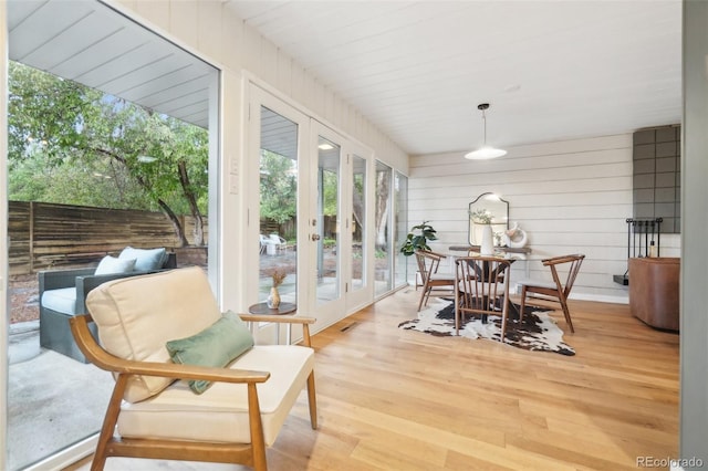 5405 S Lowell Blvd, Littleton, CO 80123 - sunroom / solarium featuring french doors, wood finished floors, and wood walls