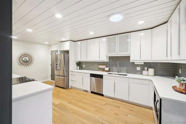 5405 S Lowell Blvd, Littleton, CO 80123 - kitchen featuring stainless steel appliances, a sink, light countertops, white cabinets, and recessed lighting