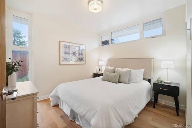 5405 S Lowell Blvd, Littleton, CO 80123 - bedroom featuring light wood-style flooring and baseboards