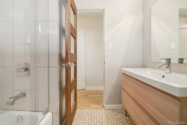 5405 S Lowell Blvd, Littleton, CO 80123 - full bathroom with baseboards and vanity