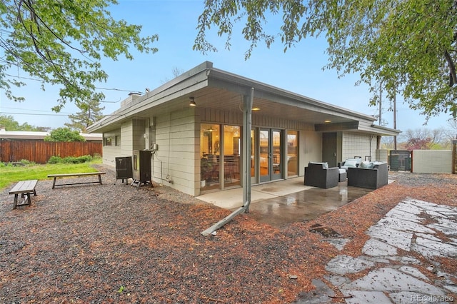 5405 S Lowell Blvd, Littleton, CO 80123 - back of property featuring fence, a patio area, and an outdoor living space