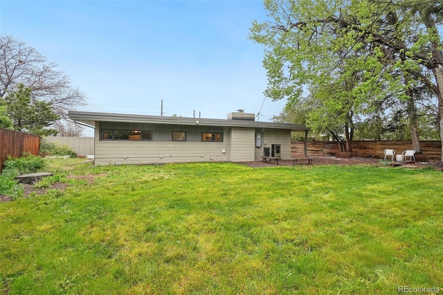 5405 S Lowell Blvd, Littleton, CO 80123 - rear view of house featuring a chimney