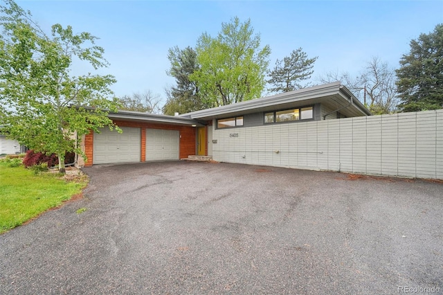 5405 S Lowell Blvd, Littleton, CO 80123 - view of front of house with a garage and driveway