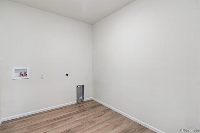 laundry room featuring electric dryer hookup, light hardwood / wood-style floors, and hookup for a washing machine