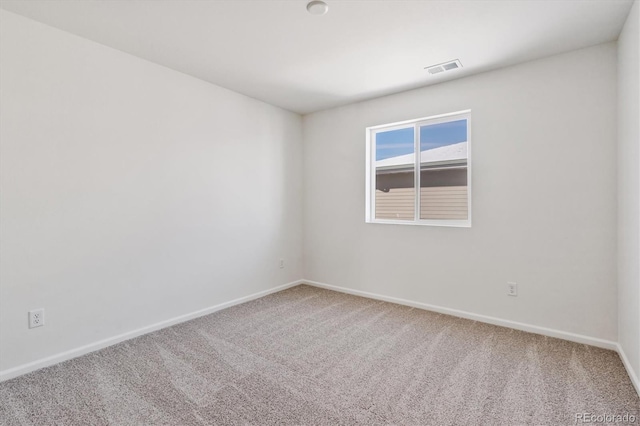 spare room with carpet floors