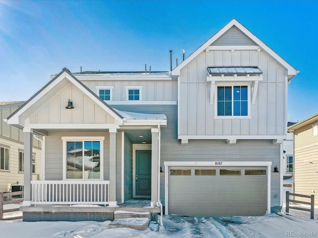 view of front of property with a porch and a garage