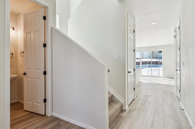 corridor featuring light hardwood / wood-style flooring