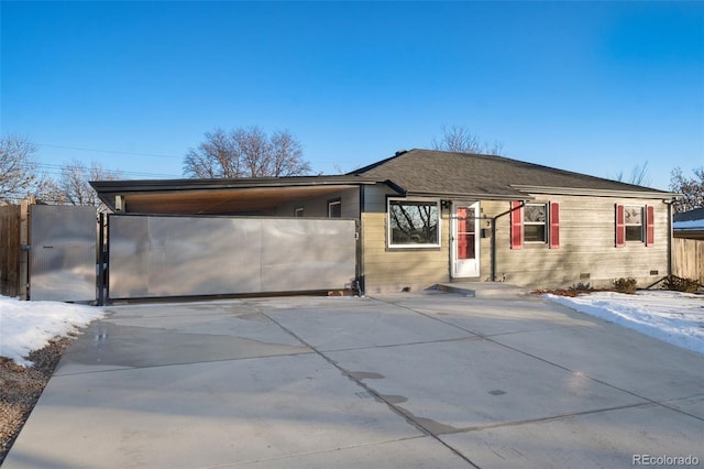 ranch-style home featuring a carport