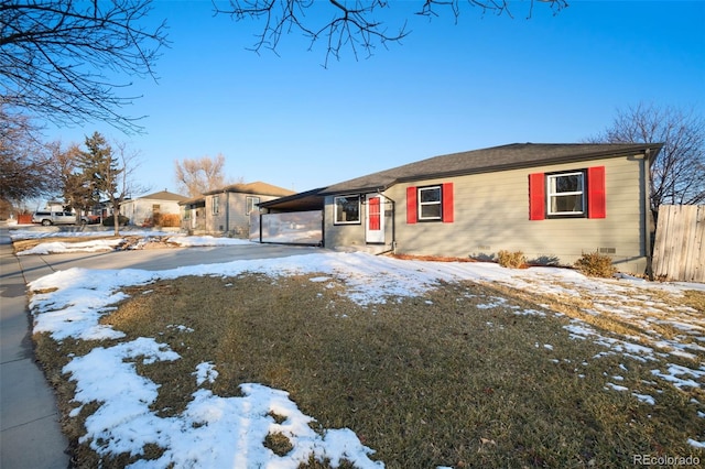 single story home featuring a carport