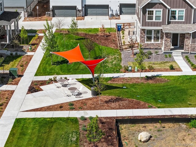 20968 E 60th Pl, Aurora, CO 80019 - view of yard featuring concrete driveway and a garage