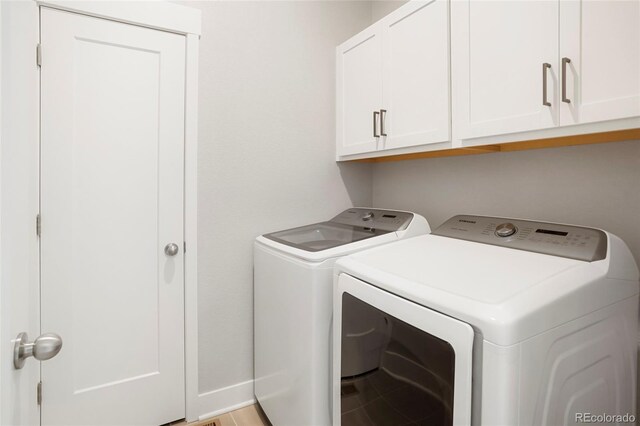 20968 E 60th Pl, Aurora, CO 80019 - laundry area featuring washing machine and clothes dryer and cabinet space