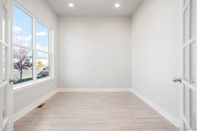20968 E 60th Pl, Aurora, CO 80019 - unfurnished room featuring plenty of natural light, light wood-style floors, and recessed lighting