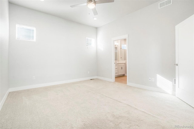 20968 E 60th Pl, Aurora, CO 80019 - unfurnished bedroom featuring light carpet, ensuite bathroom, and a ceiling fan