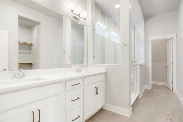 20968 E 60th Pl, Aurora, CO 80019 - full bath featuring a shower stall, double vanity, and tile patterned flooring