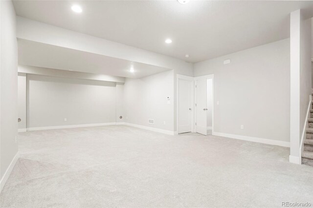 20968 E 60th Pl, Aurora, CO 80019 - finished below grade area with light colored carpet, stairs, and recessed lighting